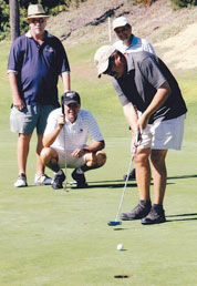 LTC's 10th Annual Golf Tournament, making the putt!